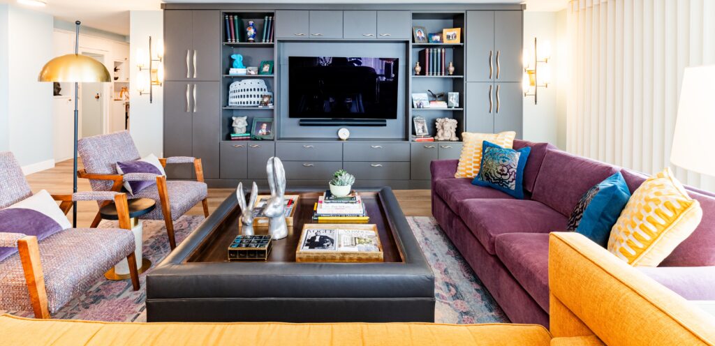 Vibrant high-rise condo living room with bold color and custom-built-ins, designed by a luxury interior designer for condos in Denver.